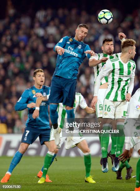 Real Madrid's Spanish defender Sergio Ramos heads the ball to score a goal during the Spanish league football match Real Betis vs Real Madrid at the...