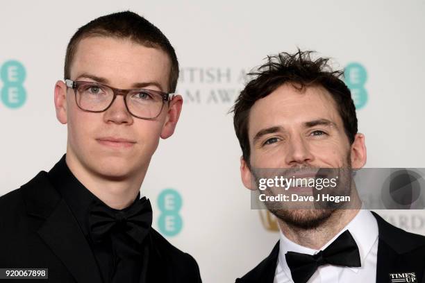 Will Poulter and Sam Claflin pose in the press room during the EE British Academy Film Awards held at Royal Albert Hall on February 18, 2018 in...