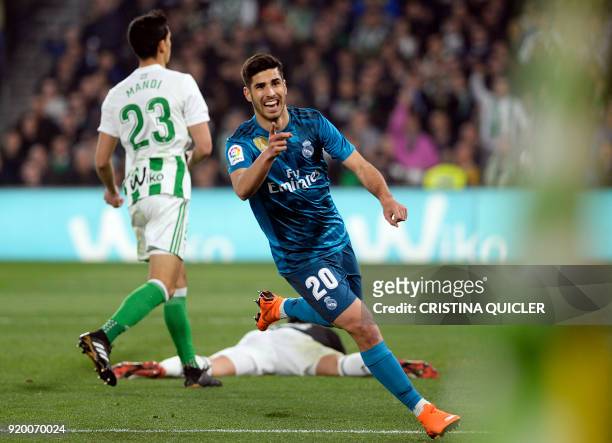 Real Madrid's Spanish midfielder Marco Asensio celebrates after scoring a goal during the Spanish league football match Real Betis vs Real Madrid at...