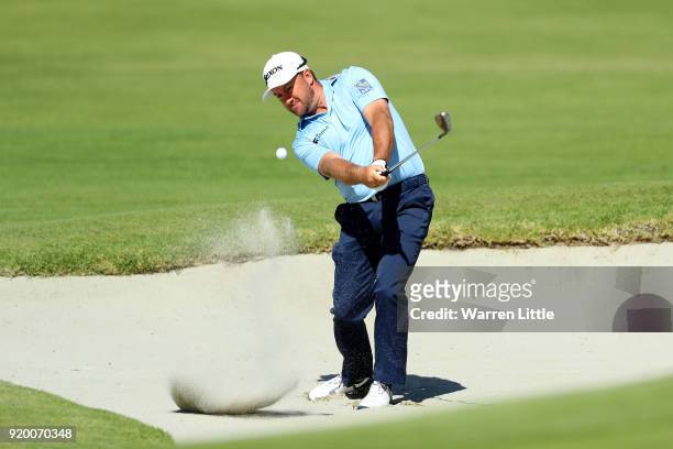 Graeme McDowell of Northern Ireland plays his shot from the bunker on the 10th hole during the final round of the Genesis Open at Riviera Country...
