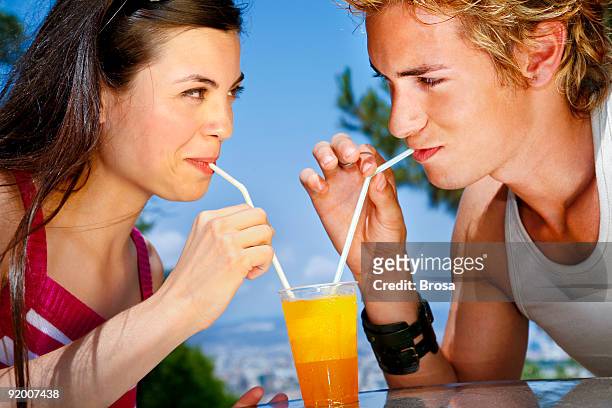 sipping together - straw lips stock pictures, royalty-free photos & images