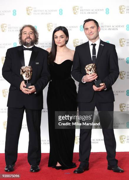 Winners of the Editing Award for 'Baby Driver', Jonathan Amos, presenter Hayley Squires and Paul Machliss pose in the press room in the press room...