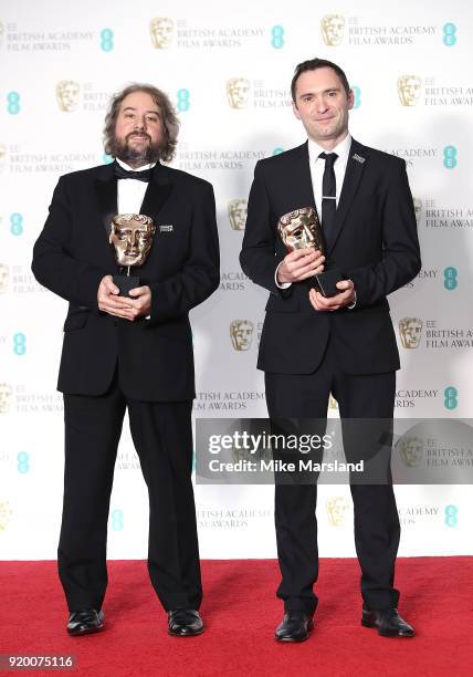 Winners of the Editing Award for 'Baby Driver', Jonathan Amos and Paul Machliss pose in the press room in the press room during the EE British...