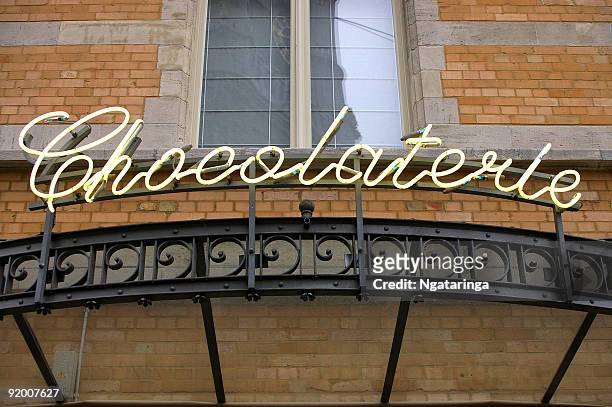 neon sign chocolaterie - belgium chocolate stock pictures, royalty-free photos & images