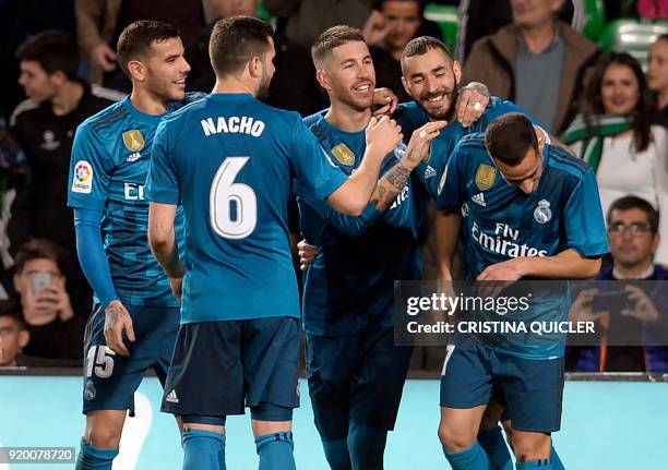 Real Madrid's French forward Karim Benzema celebrates a goal with teammates during the Spanish Liga football match Real Betis vs Real Madrid at the...