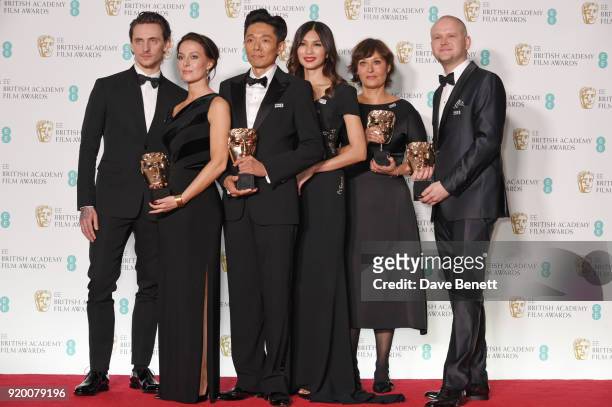 Sergei Polunin and Gemma Chan pose with Lucy Sibbick, Kazuhiro Tsuji, Ivana Primorac and David Malinowski, winners of the Best Make Up & Hair award...