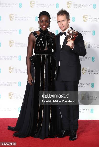 Presenter Lupita Nyong'o and Sam Rockwell, winner of the Best Supporting Actor award for the movie 'Three Billboards Outside Ebbing, Missouri' pose...