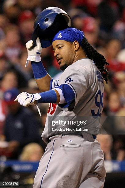 Manny Ramirez of the Los Angeles Dodgers reacts after he scored on a RBI single by Casey Blake in the top of the sixth inning against of the...