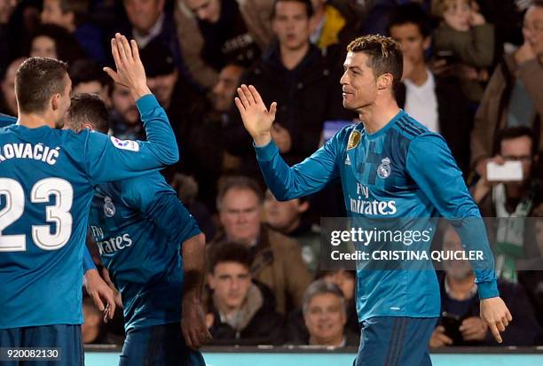 Real Madrid's French forward Real Madrid's Portuguese forward Cristiano Ronaldo celebrates scoring a goal with teammates during the Spanish league...