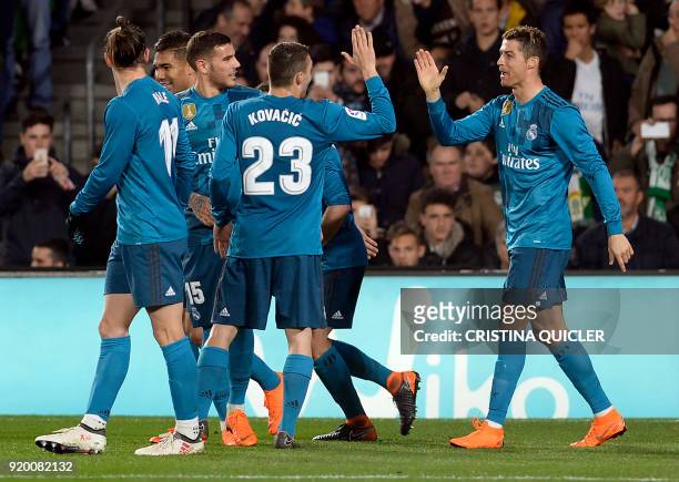 Real Madrid's French forward Real Madrid's Portuguese forward Cristiano Ronaldo celebrates scoring a goal with teammates during the Spanish league...
