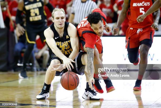 Conner Frankamp of the Witchita State Shockers and Cane Broome of the Cincinnati Bearcats rach for a loose ball during the Shockers 76-72 win at BB&T...