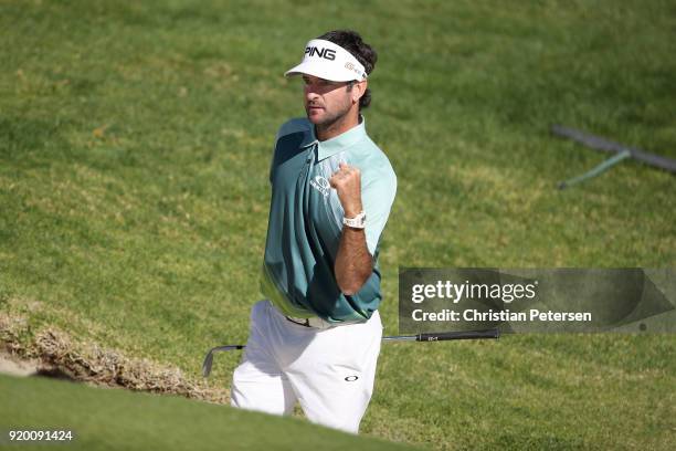 Bubba Watson reacts to his shot from the bunker on the 14th hole during the final round of the Genesis Open at Riviera Country Club on February 18,...