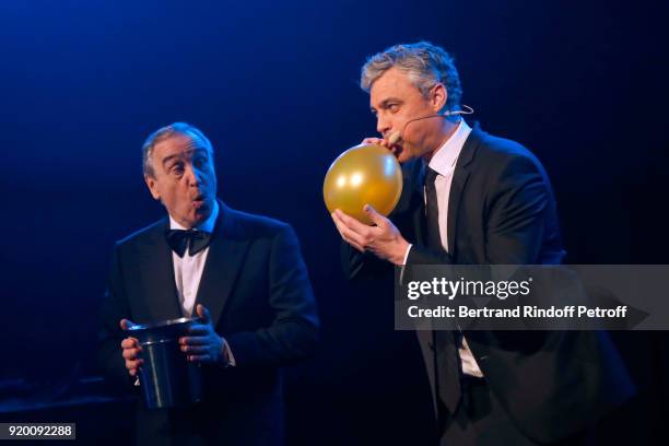 At Christie's Europe and Asia, Francois Curiel and Magician Stefan Leyshon perform during the "Snow Night - La Nuit des Neiges" Charity Gala on...