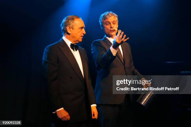 At Christie's Europe and Asia, Francois Curiel and Magician Stefan Leyshon perform during the "Snow Night - La Nuit des Neiges" Charity Gala on...