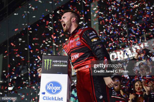 Austin Dillon, driver of the DOW Chevrolet, celebrates in Victory Lane after winning the Monster Energy NASCAR Cup Series 60th Annual Daytona 500 at...