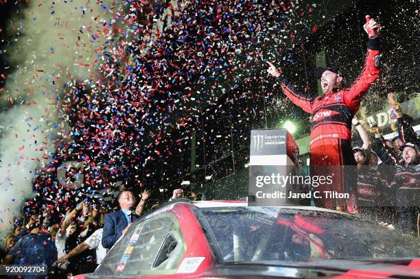 Austin Dillon, driver of the DOW Chevrolet, celebrates in Victory Lane after winning the Monster Energy NASCAR Cup Series 60th Annual Daytona 500 at...