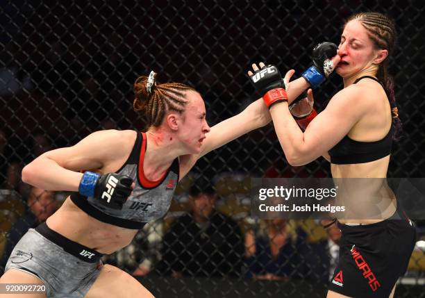 Lucie Pudilova of Czech Republic punches Sarah Moras of Canada in their women's bantamweight bout during the UFC Fight Night event at Frank Erwin...