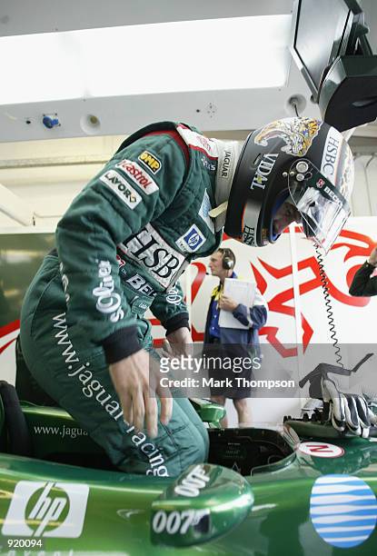 Eddie Irvine of Northern Ireland and Jaguar prepares for first practice for the British Grand Prix at Silverstone on July 5, 2002 at Silverstone...