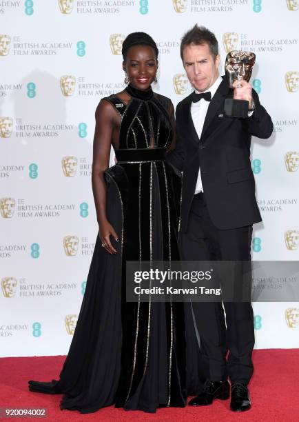 Presenter Lupita Nyong'o and winner of the Supporting Actor Award for 'Three Billboards Outside Ebbing, Missouri', Sam Rockwell pose in the press...