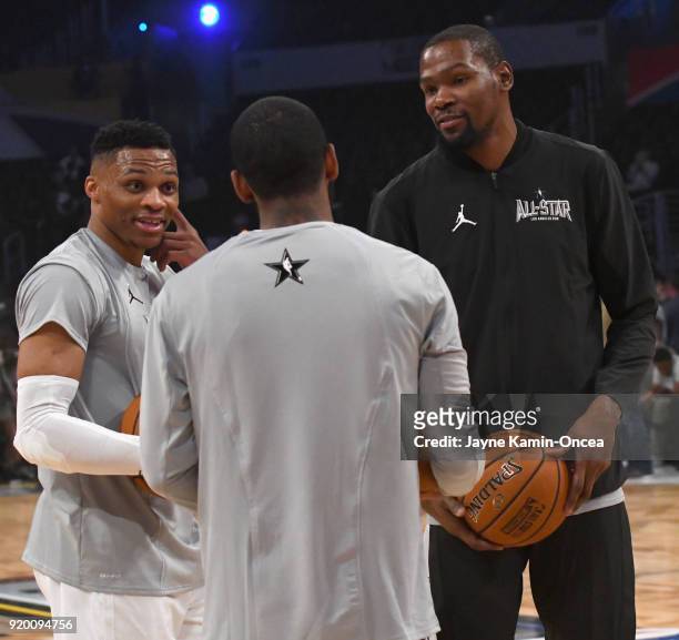 Russell Westbrook, Kevin Durant and Kyrie Irving warm up during the NBA All-Star Game 2018 at Staples Center on February 18, 2018 in Los Angeles,...