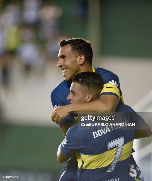 Boca Juniors' forward Carlos Tevez celebrates after scoring a goal against Banfield during their Argentina First Division Superliga football match at...