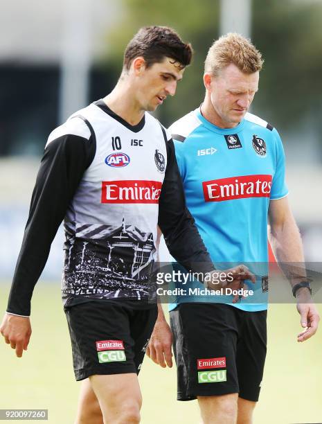 Magpies head coach Nathan Buckley talks with Scott Pendlebury as they walk off during a Collingwood Magpies AFL training session at the Holden Centre...