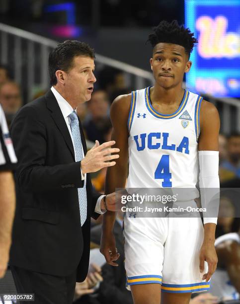 Jaylen Hands of the UCLA Bruins talks with head coach Steve Alford during a time out in the game against the Oregon State Beavers at Pauley Pavilion...