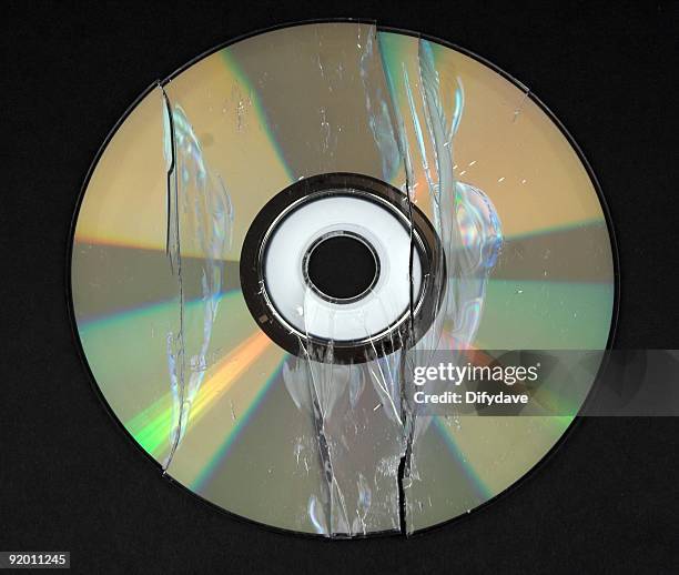 Broken Dvd Disc High-Res Stock Photo - Getty Images