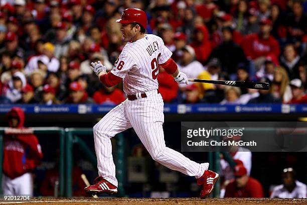 Chase Utley of the Philadelphia Phillies hits a RBI single to drive in Shane Victorino in the bottom of the sixth inning against the Los Angeles...