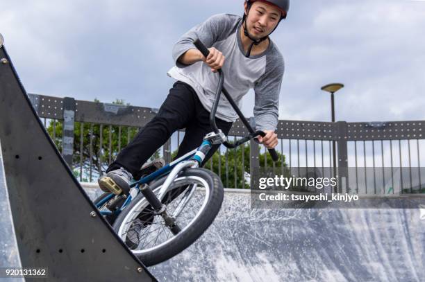 bmx rider, japan, okinawa - stunt performer stock-fotos und bilder