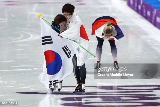 Nao Kodaira of Japan, Sang-Hwa Lee of Korea and Karolina Erbanova of the Czech Republic celebrate after winning medals during the Ladies' 500m...