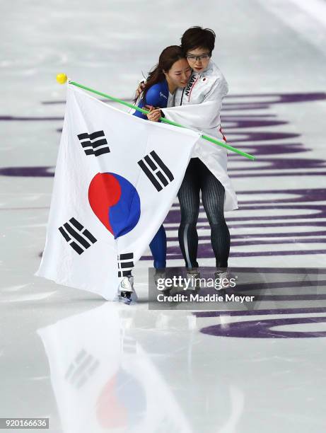 Gold medalist Nao Kodaira of Japan and silver medalist Sang-Hwa Lee of Korea embrace after winning medals during the Ladies' 500m Individual Speed...