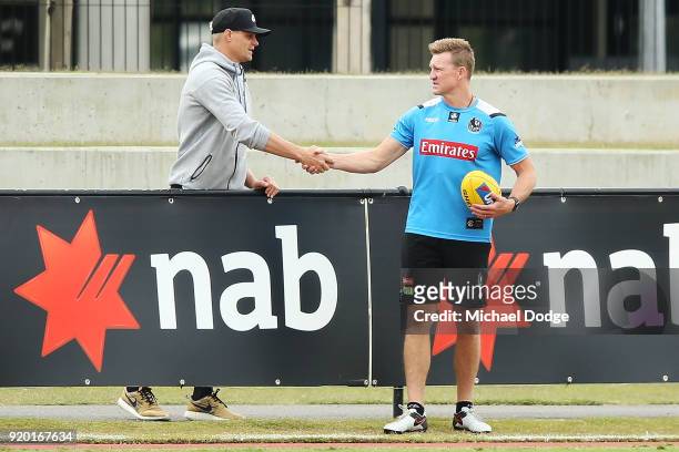 Magpies head coach Nathan Buckley is seen with former St.Kilda champion Nick Riewoldt during a Collingwood Magpies AFL training session at the Holden...