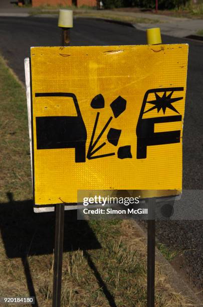 road sign warning drivers about loose stones and rocks on the street surface - loose gravel stock pictures, royalty-free photos & images