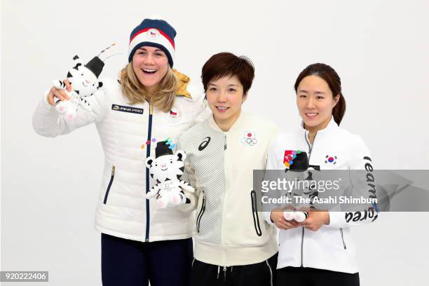 Bronze medalist Karolina Erbanova of the Czech Republic, gold medalist Nao Kodaira of Japan and silver medalist Sang-Hwa Lee of Korea celebrate on...