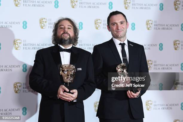 Paul Machliss and Jonathan Amos, winners of the Best Editing award for the movie 'Baby Driver' pose in the press room during the EE British Academy...