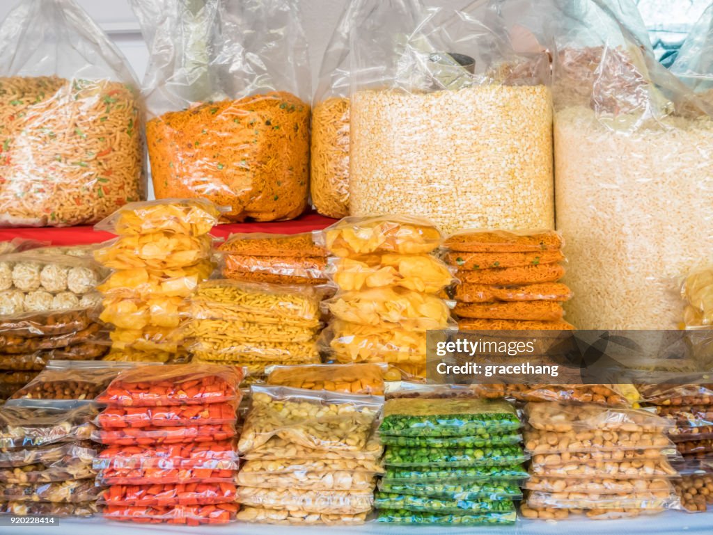 Variety types of Indian snacks selling in the shop.