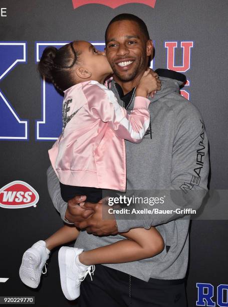 Football player Victor Cruz and daughter Kennedy Cruz attends ROOKIE USA Fashion Show at Milk Studios on February 15, 2018 in Los Angeles, California.