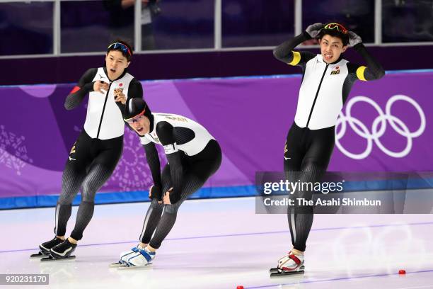 Shota Nakamura, Shane Williamson and Seitaro Ichinohe of Japan react after competing the Speed Skating Men's Team Pursuit quarter final on day nine...