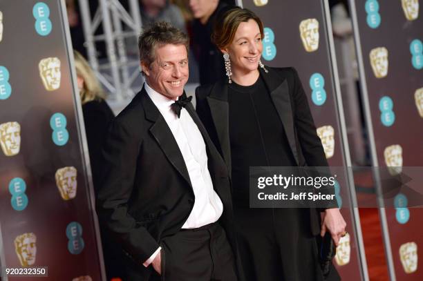 Hugh Grant and Anna Eberstein attend the EE British Academy Film Awards held at Royal Albert Hall on February 18, 2018 in London, England.