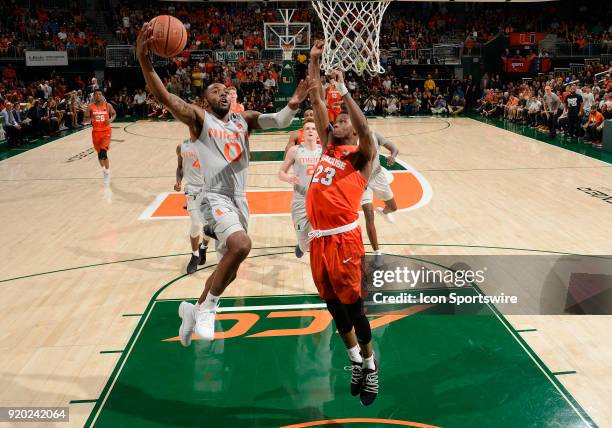 Miami guard Ja'Quan Newton shoots during a college basketball game between the Syracuse University Orange and the University of Miami Hurricanes on...