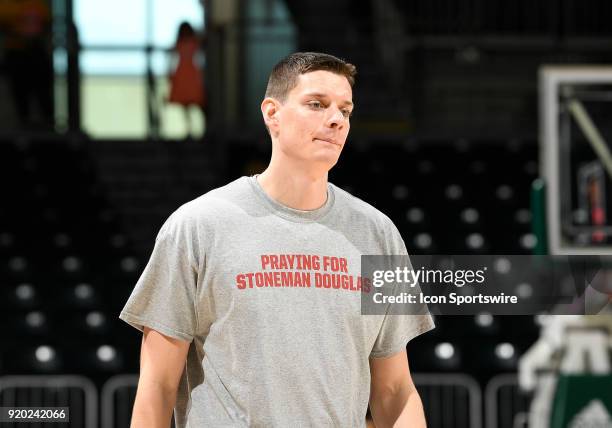 Miami forward Chris Stowell wears a warm up tee shirt honoring the murdered students at Stoneman Douglas High School worn by both teams before a...