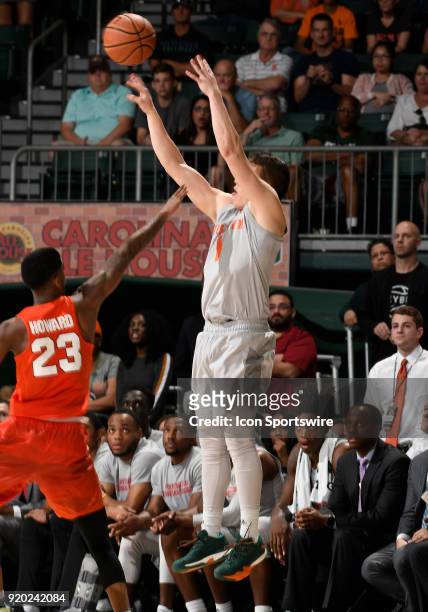 Miami guard Dejan Vasiljevic shoots during a college basketball game between the Syracuse University Orange and the University of Miami Hurricanes on...