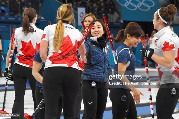 Satsuki Fujisawa of Japan shakes hands with Emma Miskew of Canada after the Curling Women's Round Robin Session 8 against Canada on day ten of the...