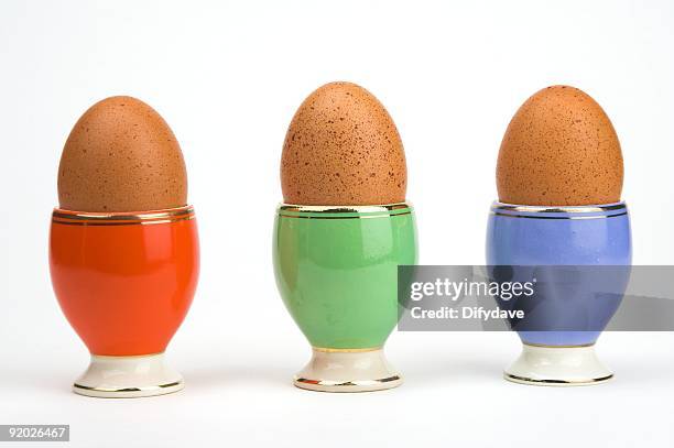 one egg or three - egg cup stock pictures, royalty-free photos & images