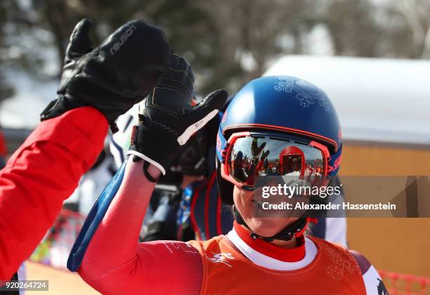 Lara Gut of Switzerland gives a 'high five' during Alpine Skiing Ladies' Downhill Training on day 10 of the PyeongChang 2018 Winter Olympic Games at...
