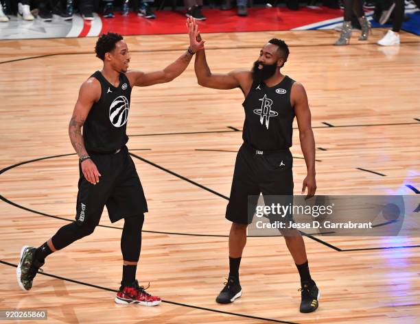 DeMar DeRozan of Team Curry gives James Harden a high five against Team LeBron during the NBA All-Star Game as a part of 2018 NBA All-Star Weekend at...