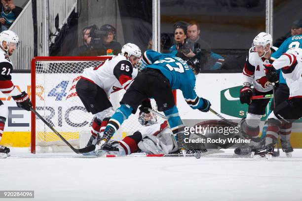 Jason Demers and Scott Wedgewood of the Arizona Coyotes defend the net against Joonas Donskoi of the San Jose Sharks at SAP Center on February 13,...
