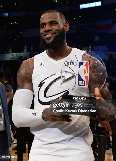 LeBron James hoists the All-Star Game MVP trophy during the NBA All-Star Game 2018 at Staples Center on February 18, 2018 in Los Angeles, California.