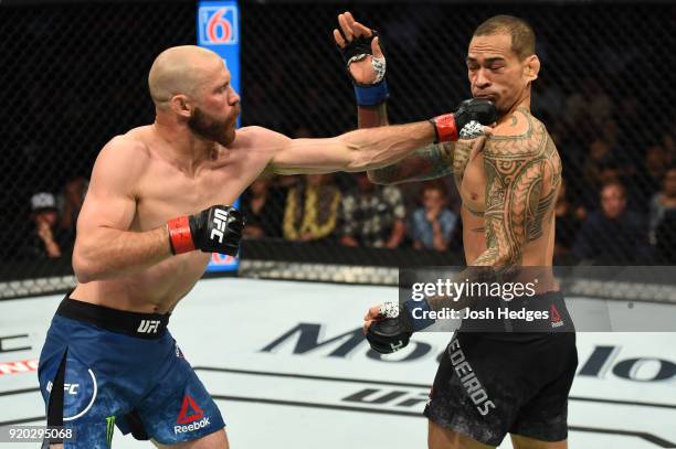 Donald Cerrone punches Yancy Medeiros in their welterweight bout during the UFC Fight Night event at Frank Erwin Center on February 18, 2018 in...